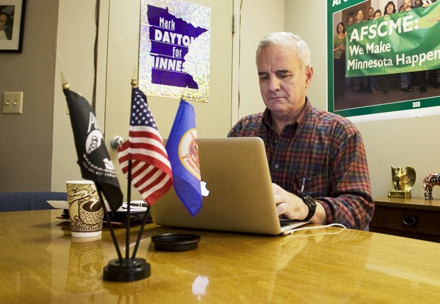 Governor Dayton using laptop